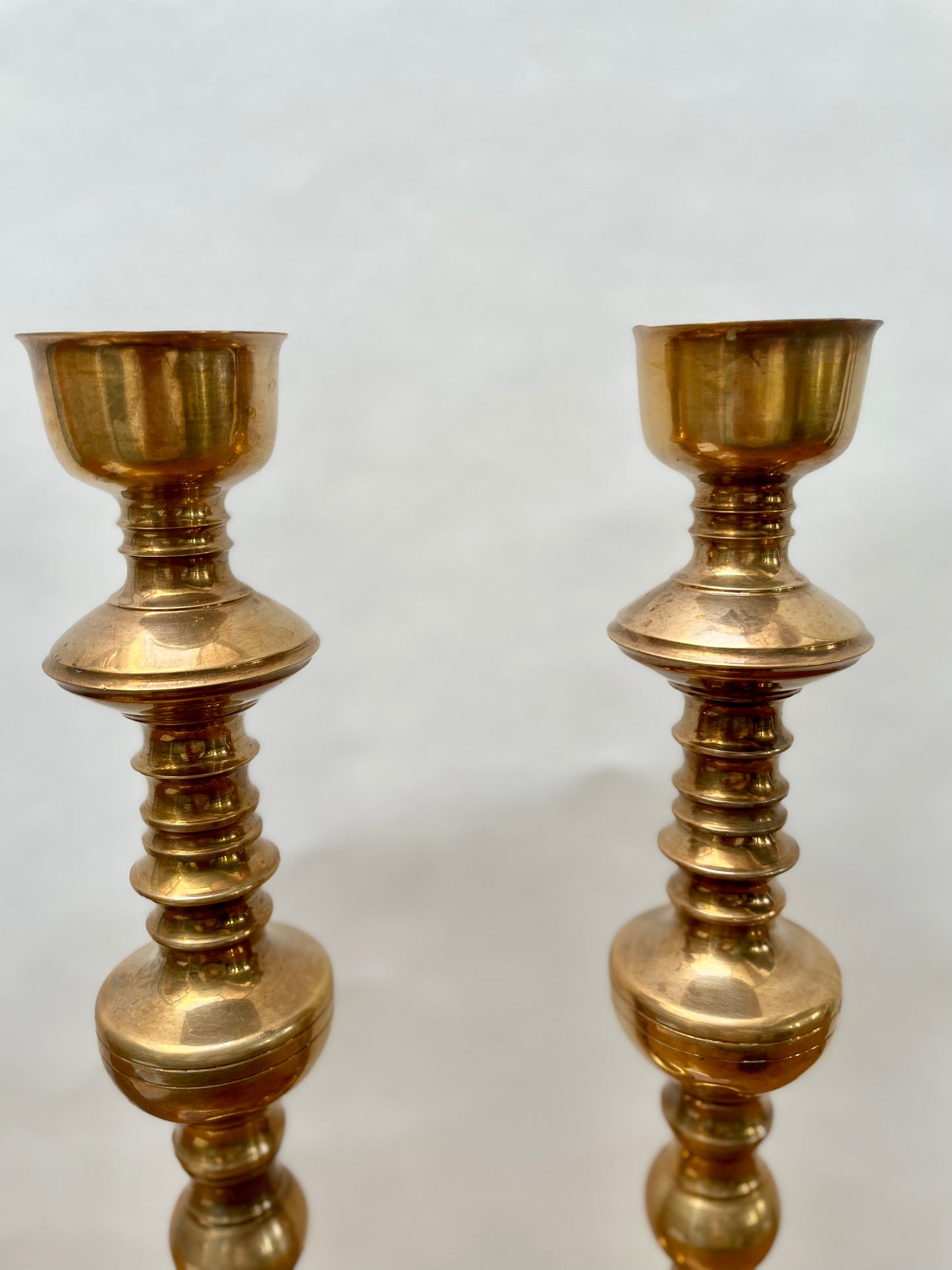 Tall brass mid century candlesticks in the Moroccan style