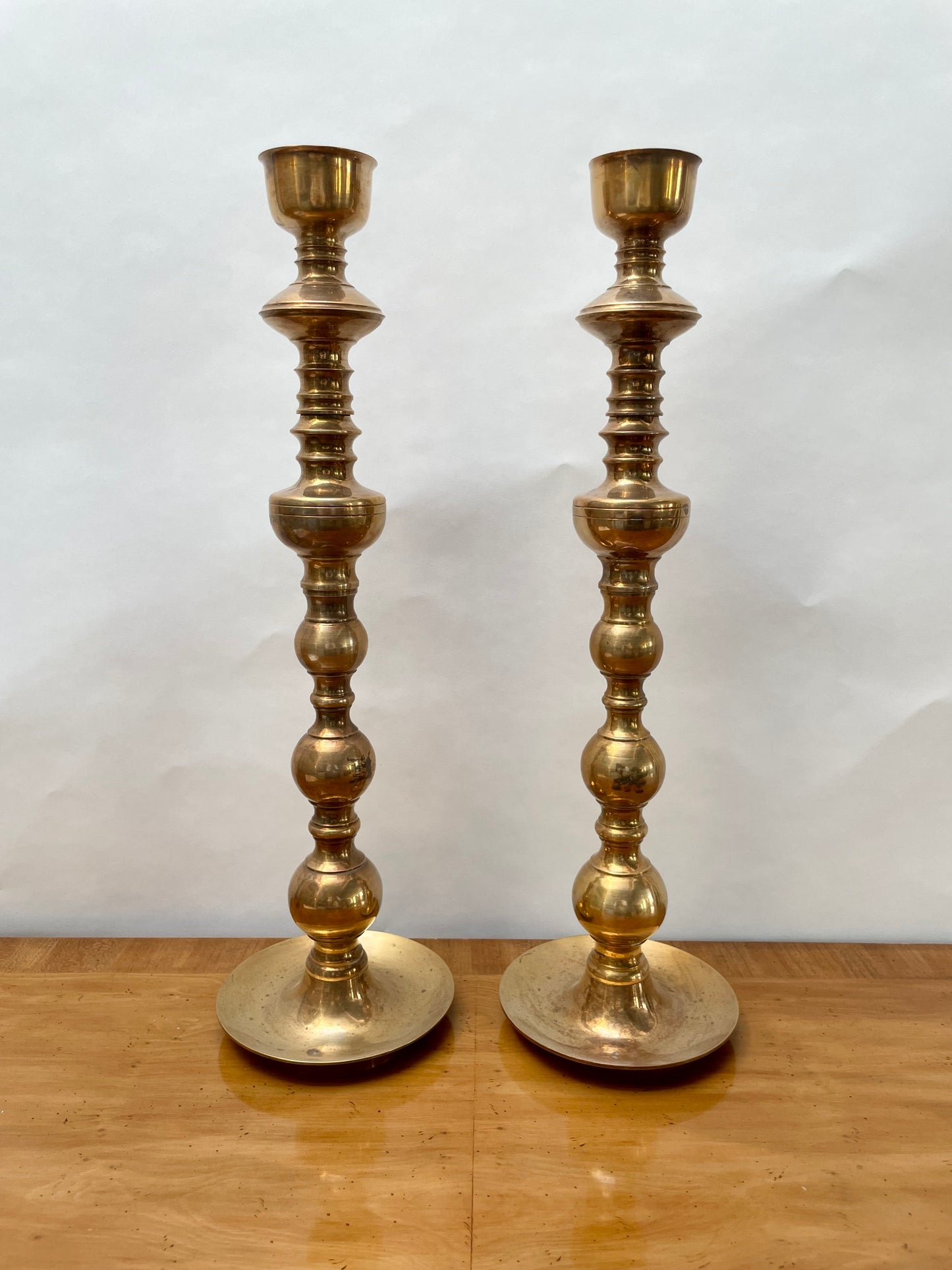 Tall brass mid century candlesticks in the Moroccan style